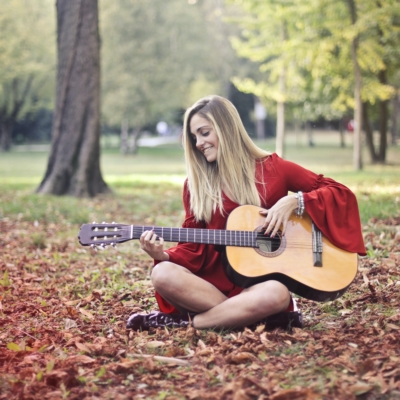 Woman playing Acoustic guitar - pexels-andrea-piacquadio-3756163