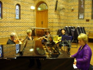 Adults playing in a Piano Quartet